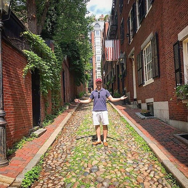 Carter on a cobblestone street