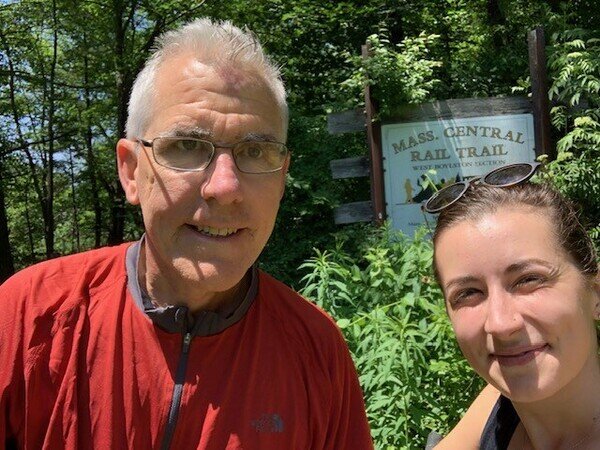 Charlie with woman by nature preserve