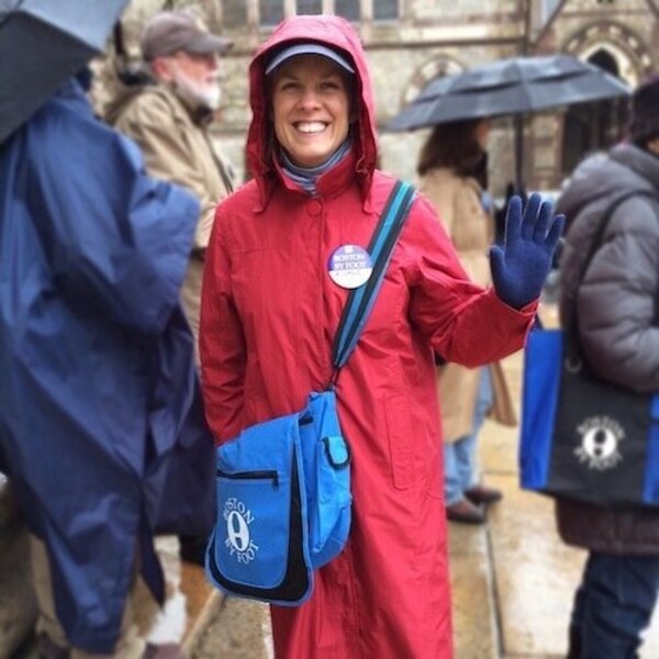 Michele Steinberg in rain coat with shoulder bag