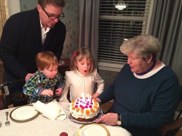 Helen with kids and birthday cake