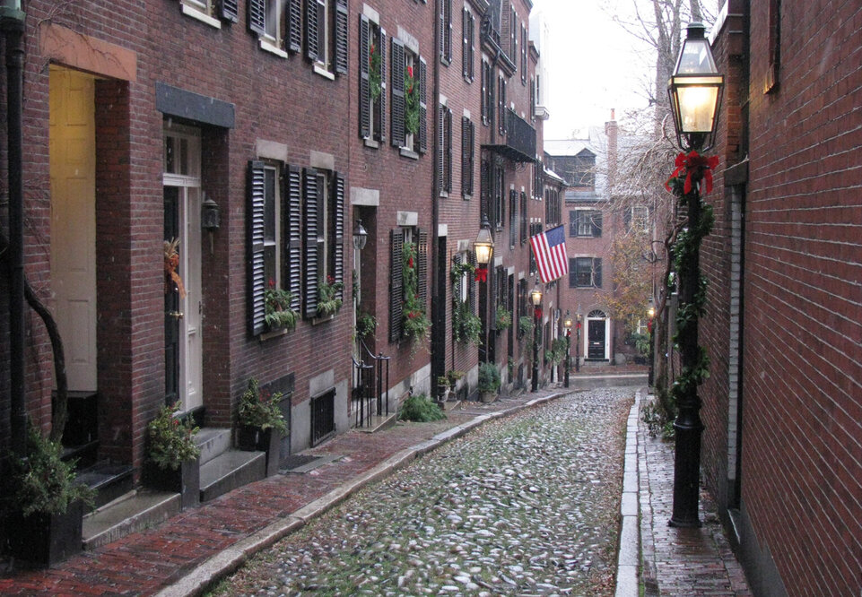 acorn street cobblestones with american flag  beacon hill boston
