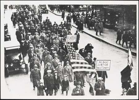protesters with american flags marching