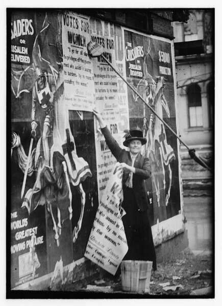 Woman gluing posters to wall 19th century